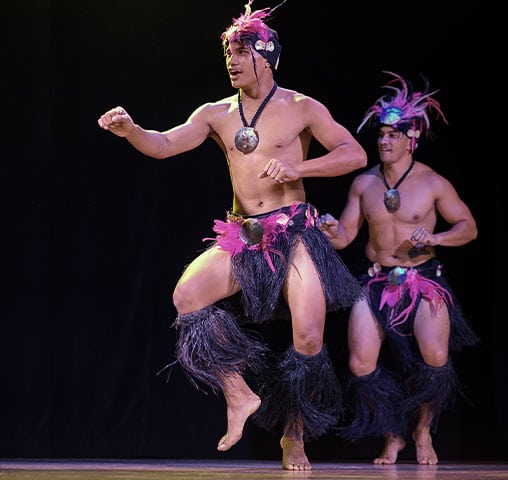 A Polynesian dance troupe performing for guests aboard the m/s Paul Gauguin.