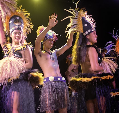 A Polynesian dance troupe performing for guests aboard the m/s Paul Gauguin.