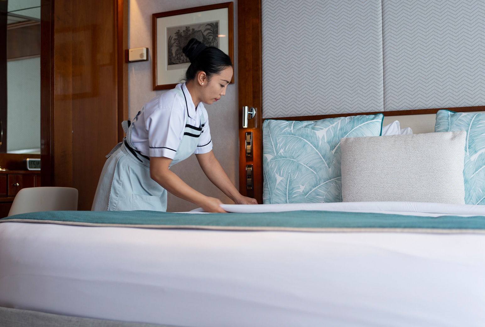 room attendant making up stateroom