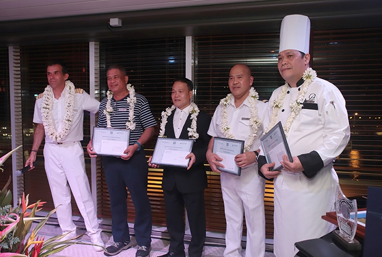 Captain Michel Quioc honors crew members for their 25 years of exemplary service (L to R):  Captain Quioc, Master of The Gauguin; Philip Rizan, Tender Master; Alexander Francisco, Ship’s Printer; Apolinario, Jr., Head Waiter; Virgil Elefane, Ship’s Cook. Not pictured: Jovito Calimlim, Ship’s Cook.