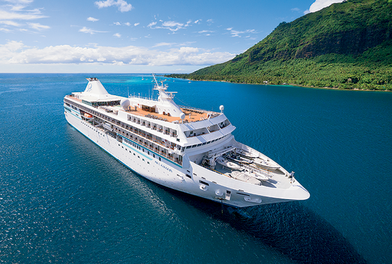 Paul Gauguin Cruises | Ship sails the waters of Moorea