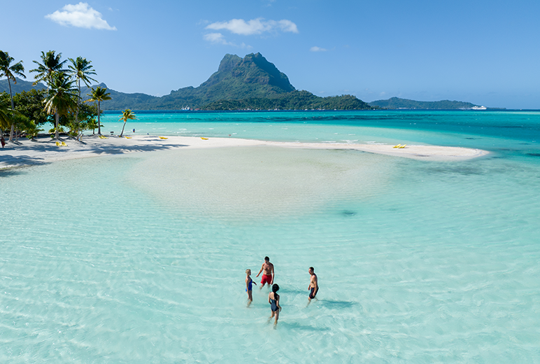 Paul Gauguin Cruises | Guests enjoy the sandbars of Bora Bora