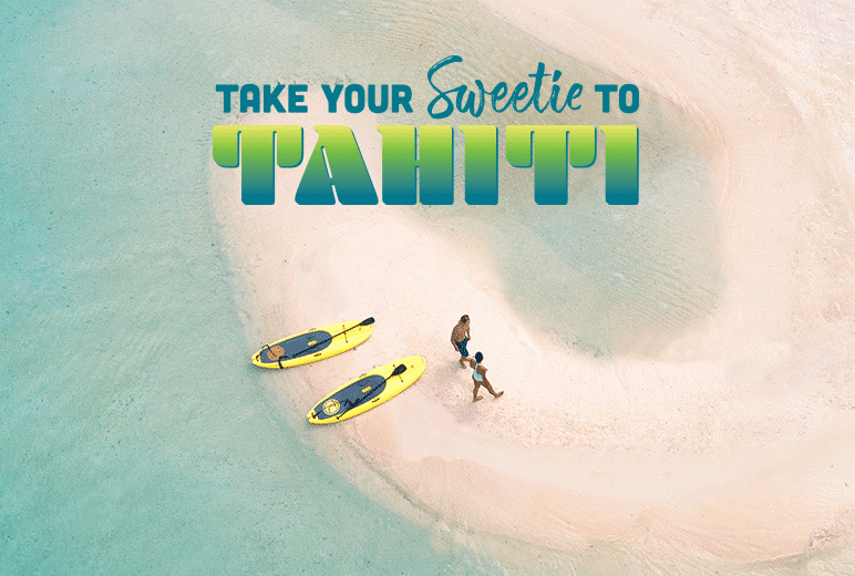 couple lounging on white sand beaches in Bora Bora