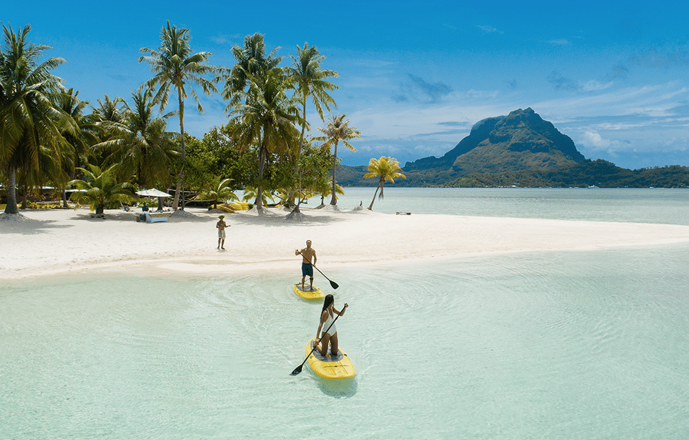 Paul Gauguin Cruises | Paddle boarding in Tahitir